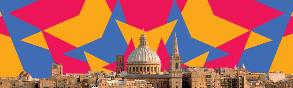 A cityscape featuring historical buildings with domes and spires in the foreground stands against a vibrant background of bold geometric patterns in pink, yellow, and blue. The juxtaposition of architecture and abstract shapes creates a striking visual contrast.